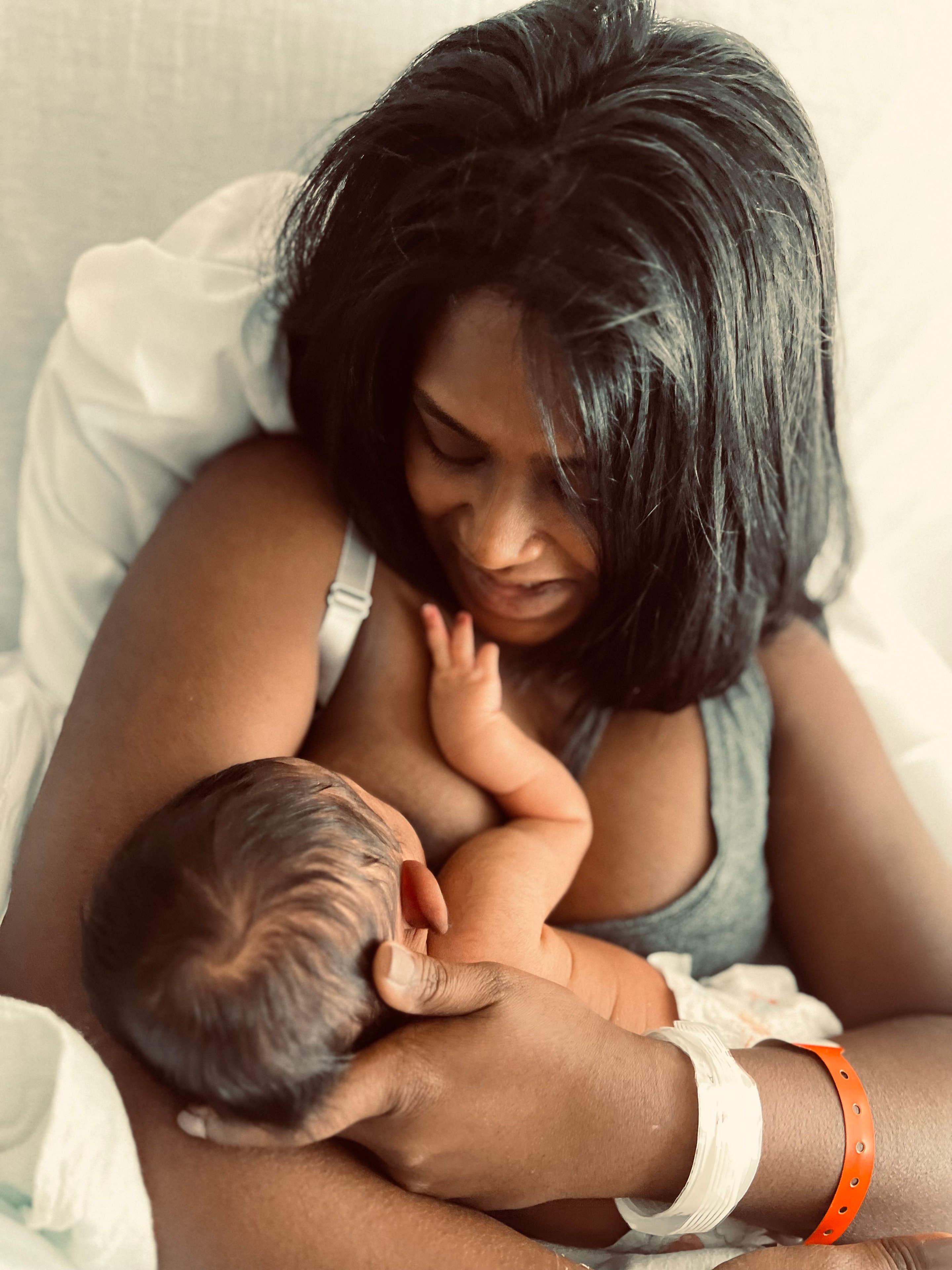 Mother breastfeeding newborn