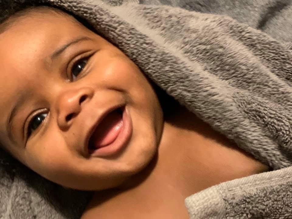 Smiling newborn baby